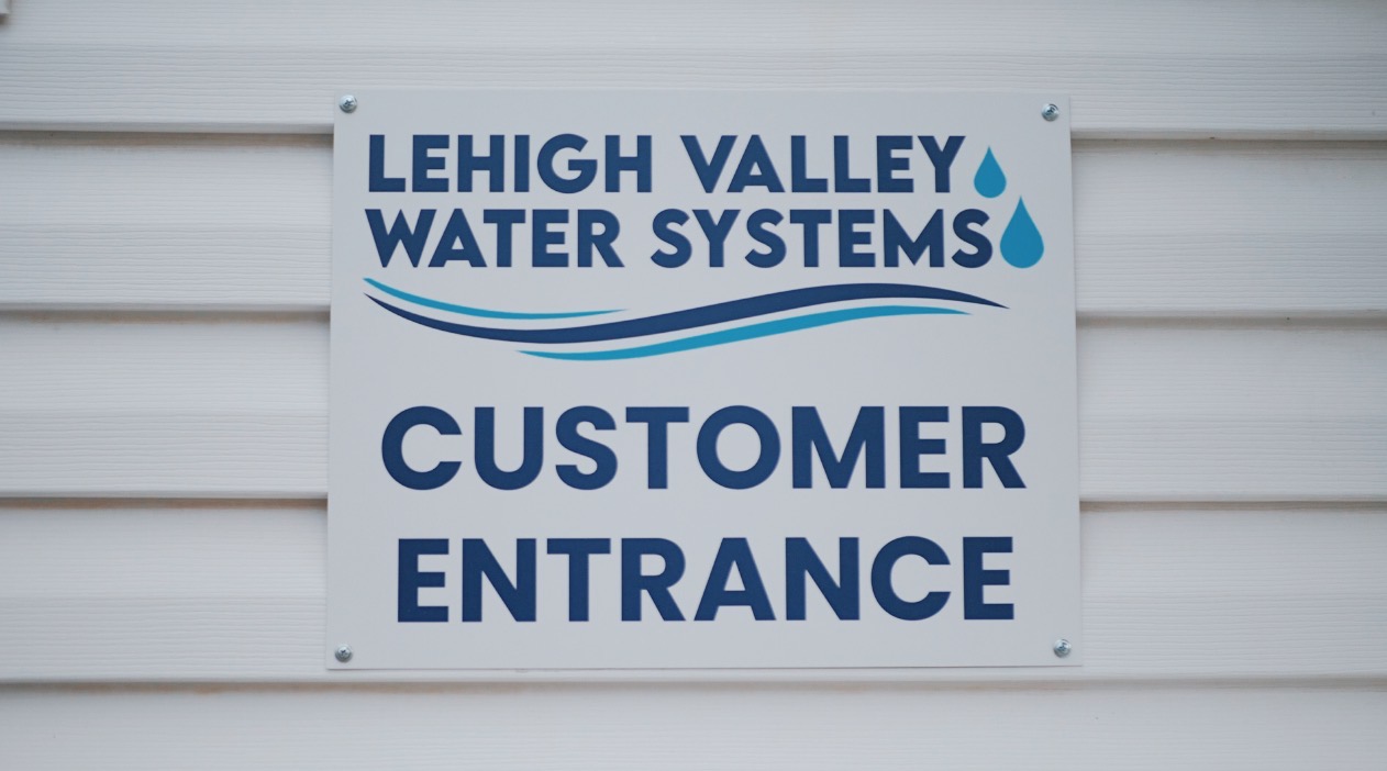 Lehigh Valley Water Systems sign saying " Customer Entrance "