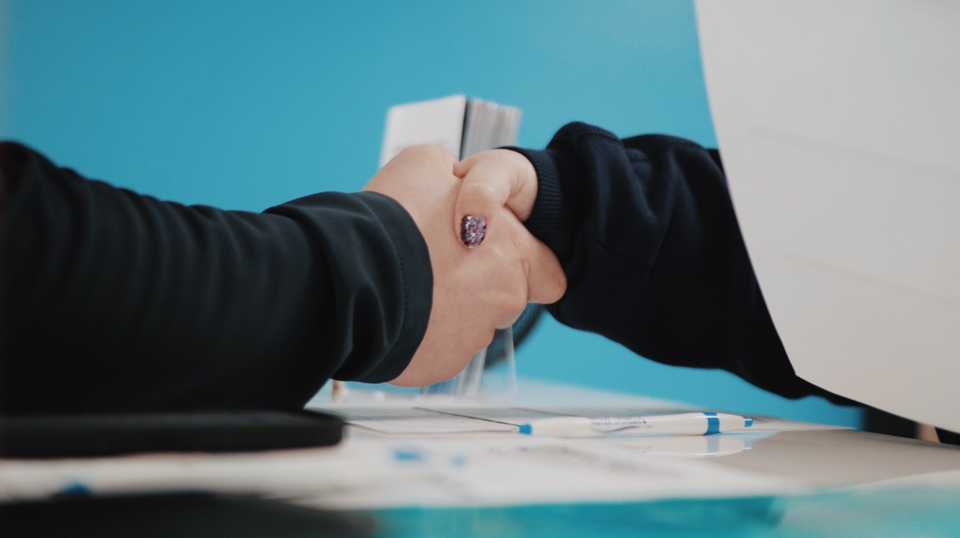 Two people handshaking