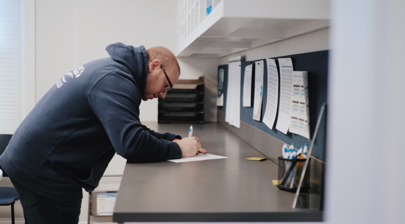 A Lehigh Valley Water Systems employee writing something down