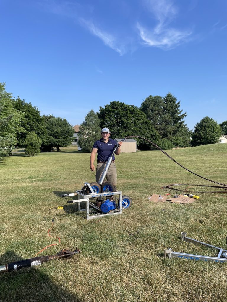Staff member working on water pipes